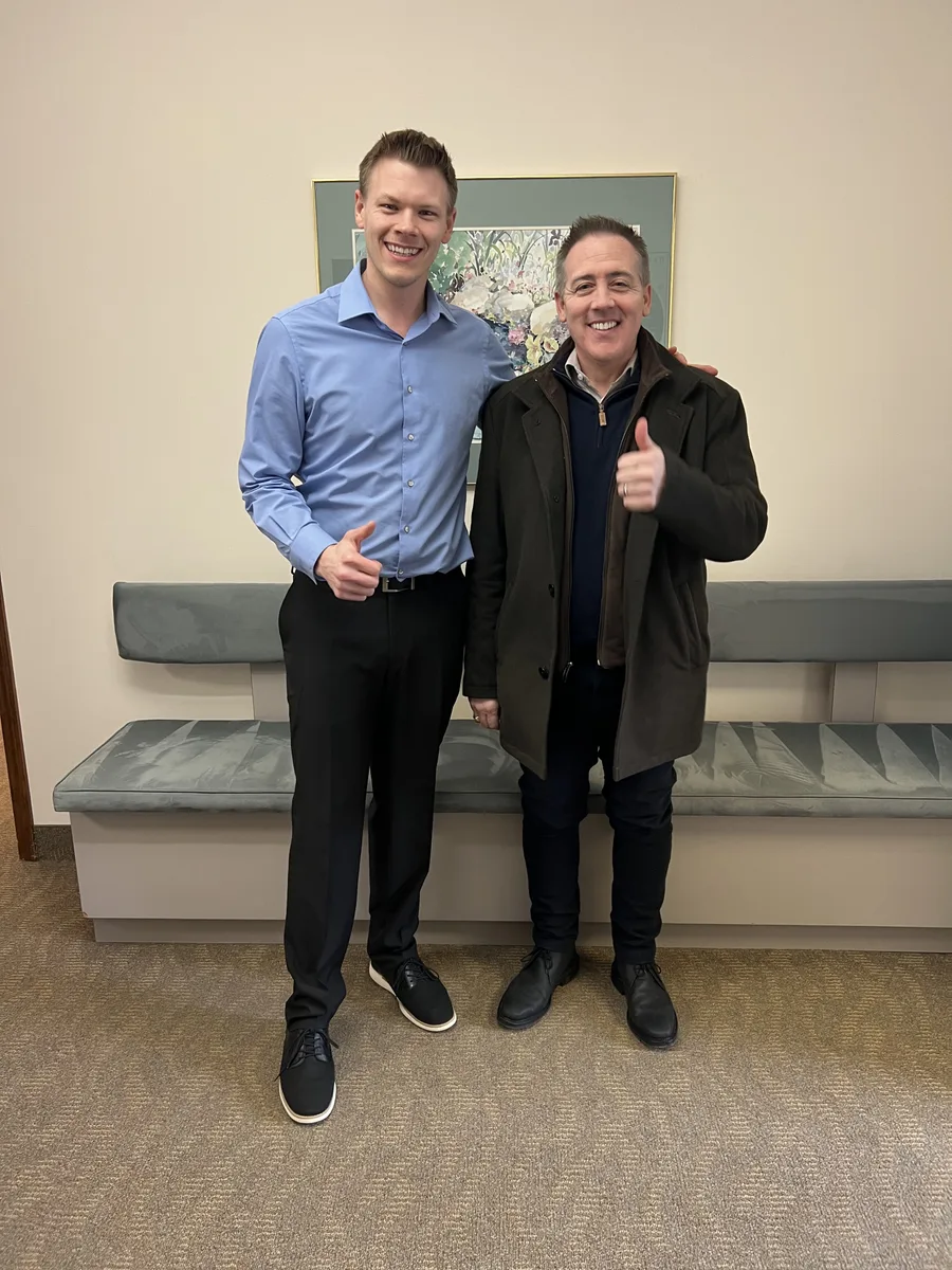Dr. Jonathan Waltman with a patient in the Thornapple River Chiropractic reception area