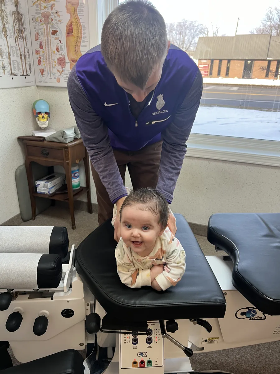 Gentle pediatric chiropractic adjustment for an infant