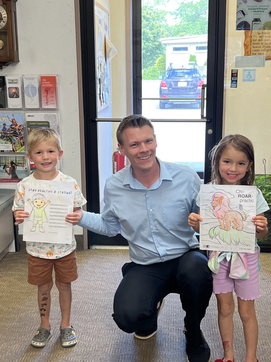 Dr. Jonathan Waltman with young patients at Thornapple River Chiropractic